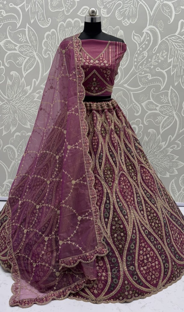 Abstinent Magenta Art of Work with Detailed Thread work Designer LehengaCholi perfect for reception wear