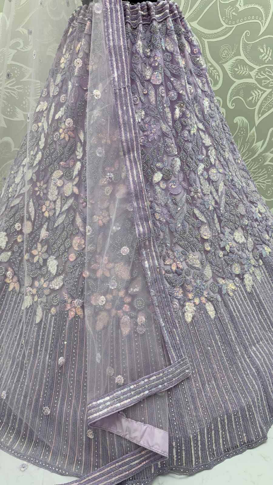 Eye-Catchy Lavender Lehengacholi studded with zircon diamond and Full of Sequins work 