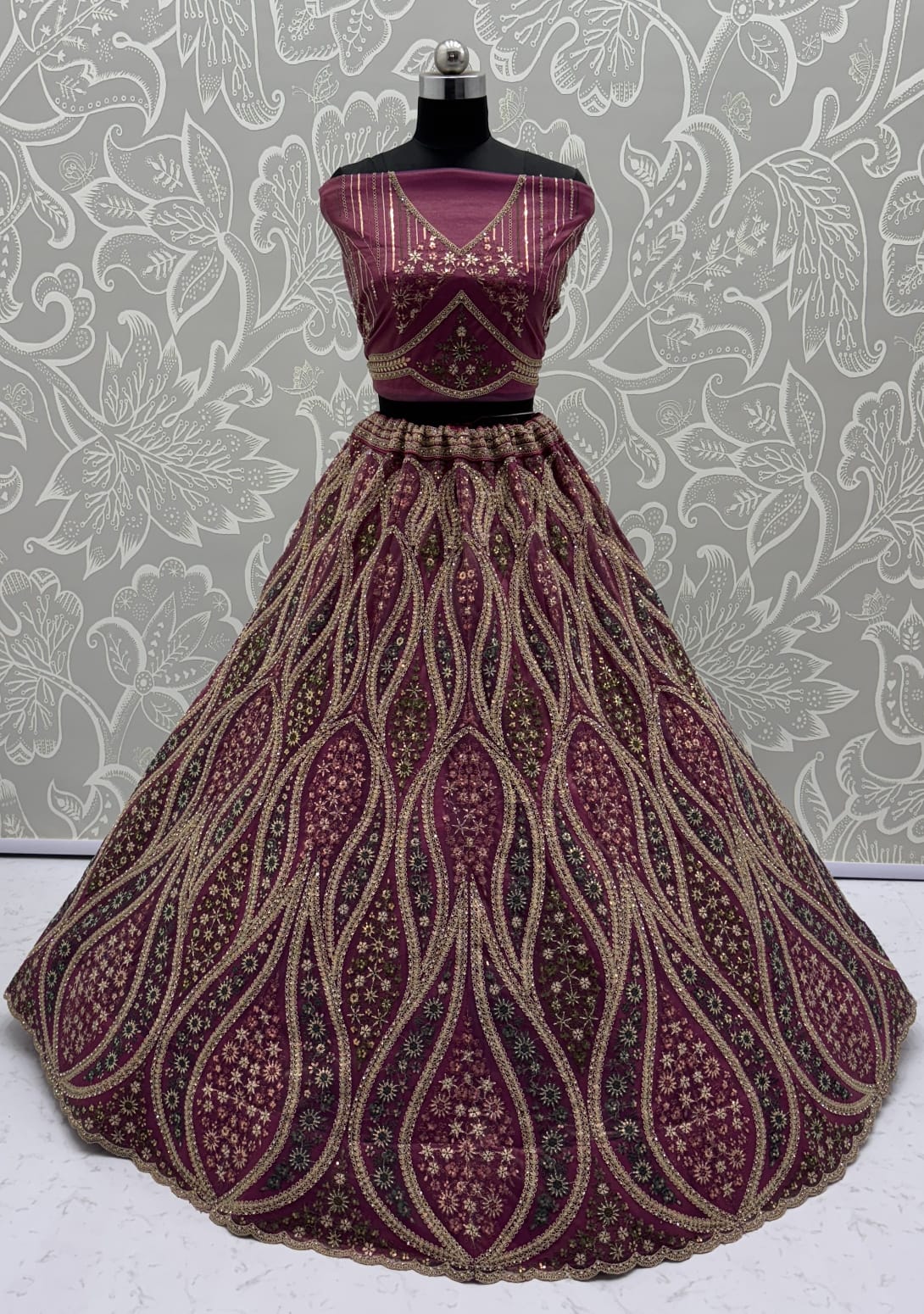 Abstinent Magenta Art of Work with Detailed Thread work Designer LehengaCholi perfect for reception wear