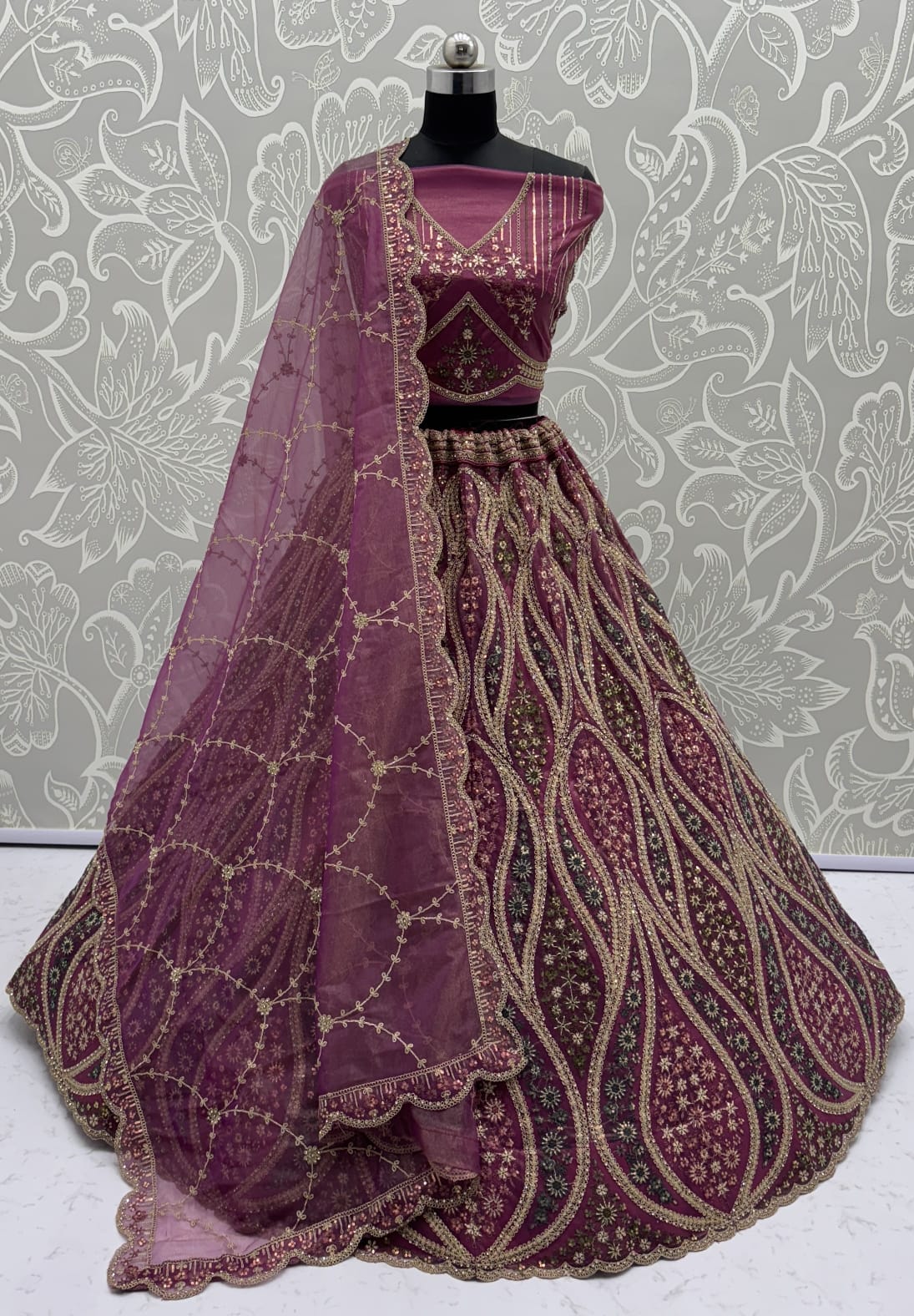 Abstinent Magenta Art of Work with Detailed Thread work Designer LehengaCholi perfect for reception wear