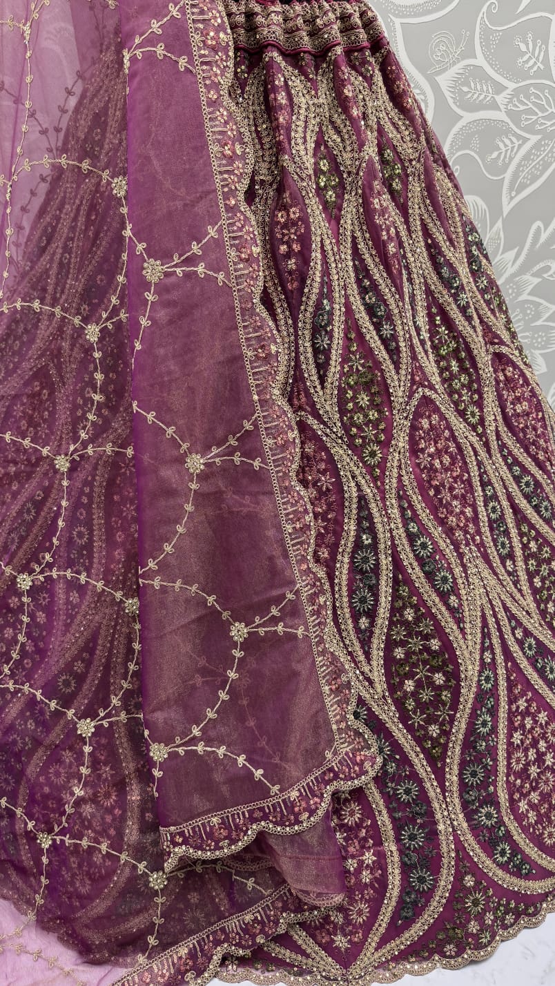 Abstinent Magenta Art of Work with Detailed Thread work Designer LehengaCholi perfect for reception wear