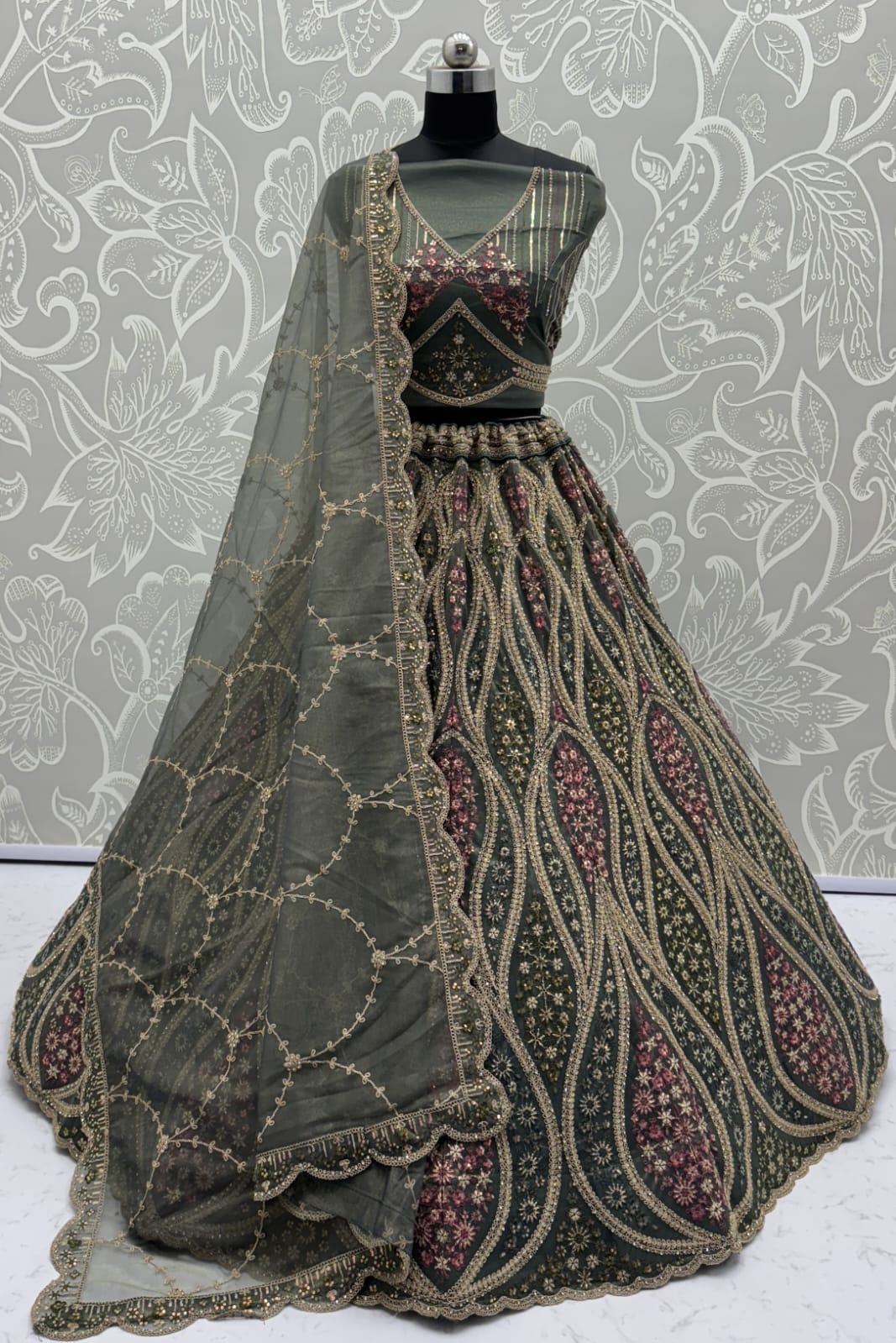 Abstinent Olive Green Art of Work with Detailed Thread work Designer LehengaCholi perfect for reception wear