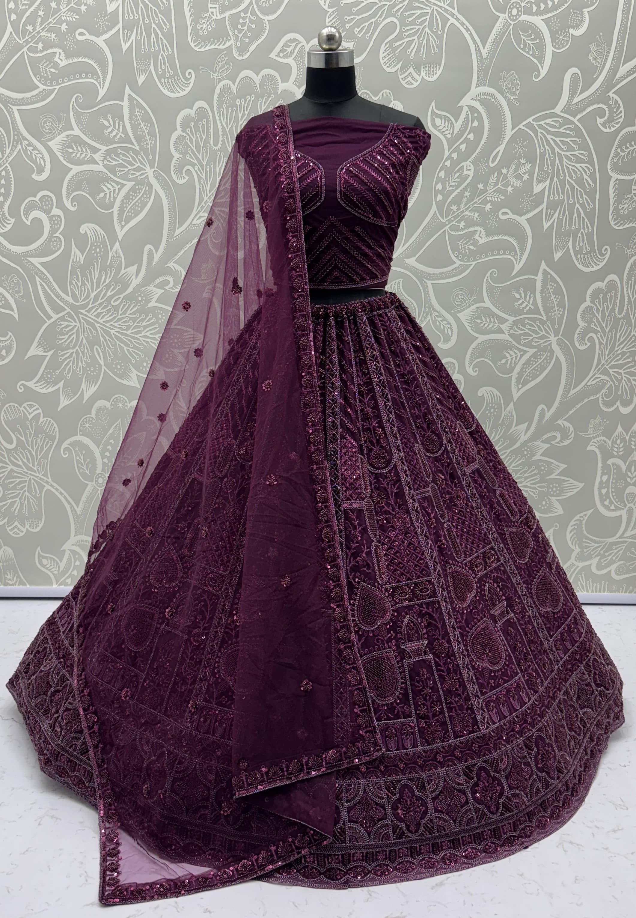 Sober Handwork Maroon Motif and Crystal Pipe work Designed Reception Wear Collection in Lehenga Choli