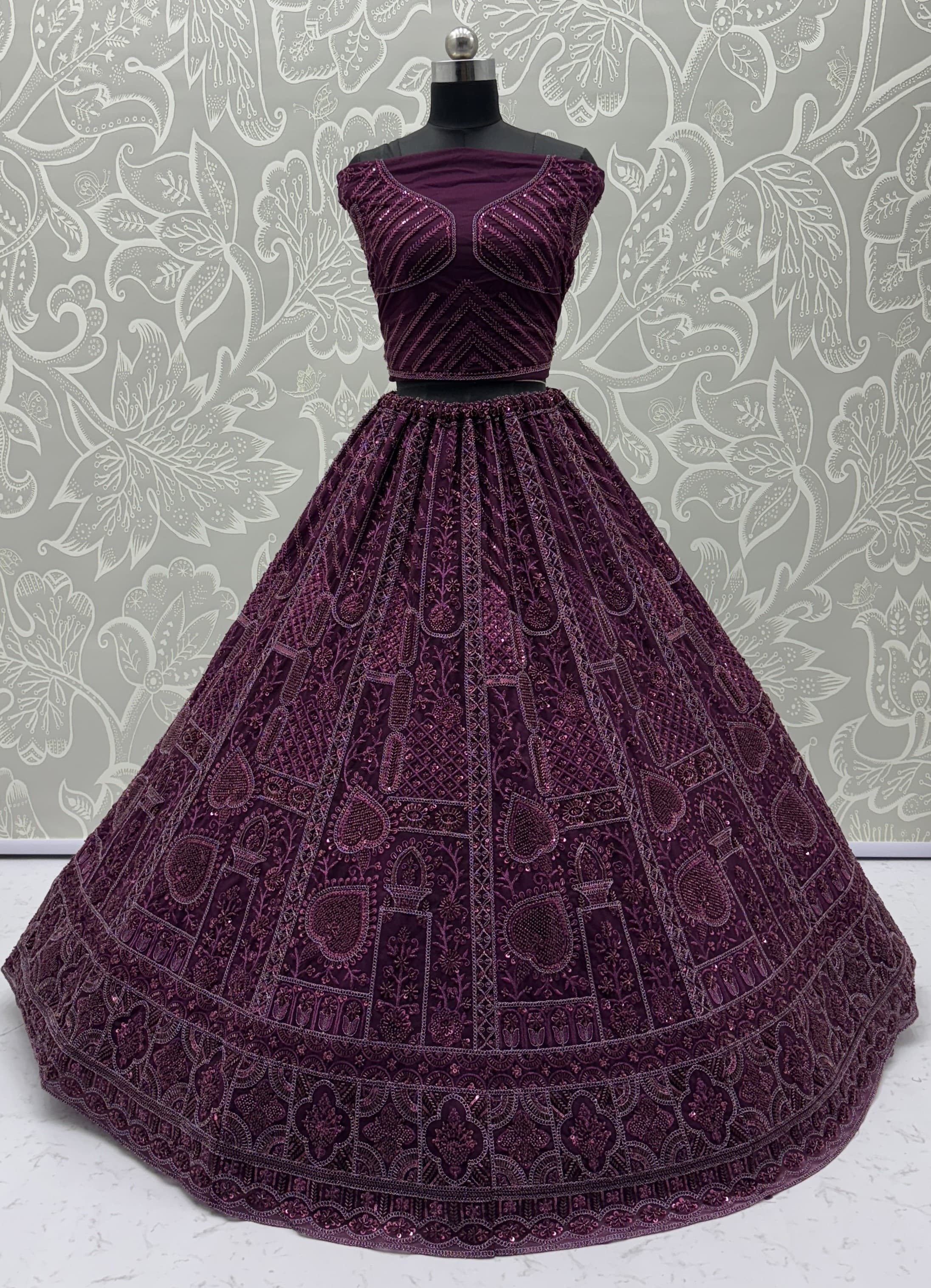 Sober Handwork Maroon Motif and Crystal Pipe work Designed Reception Wear Collection in Lehenga Choli